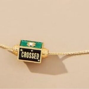 Anthropologie Spinner Green and Black Necklace “Fingers Crossed”